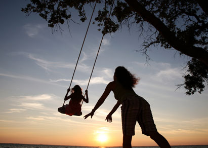 12-istock-Mother-swinging-daughter-Small